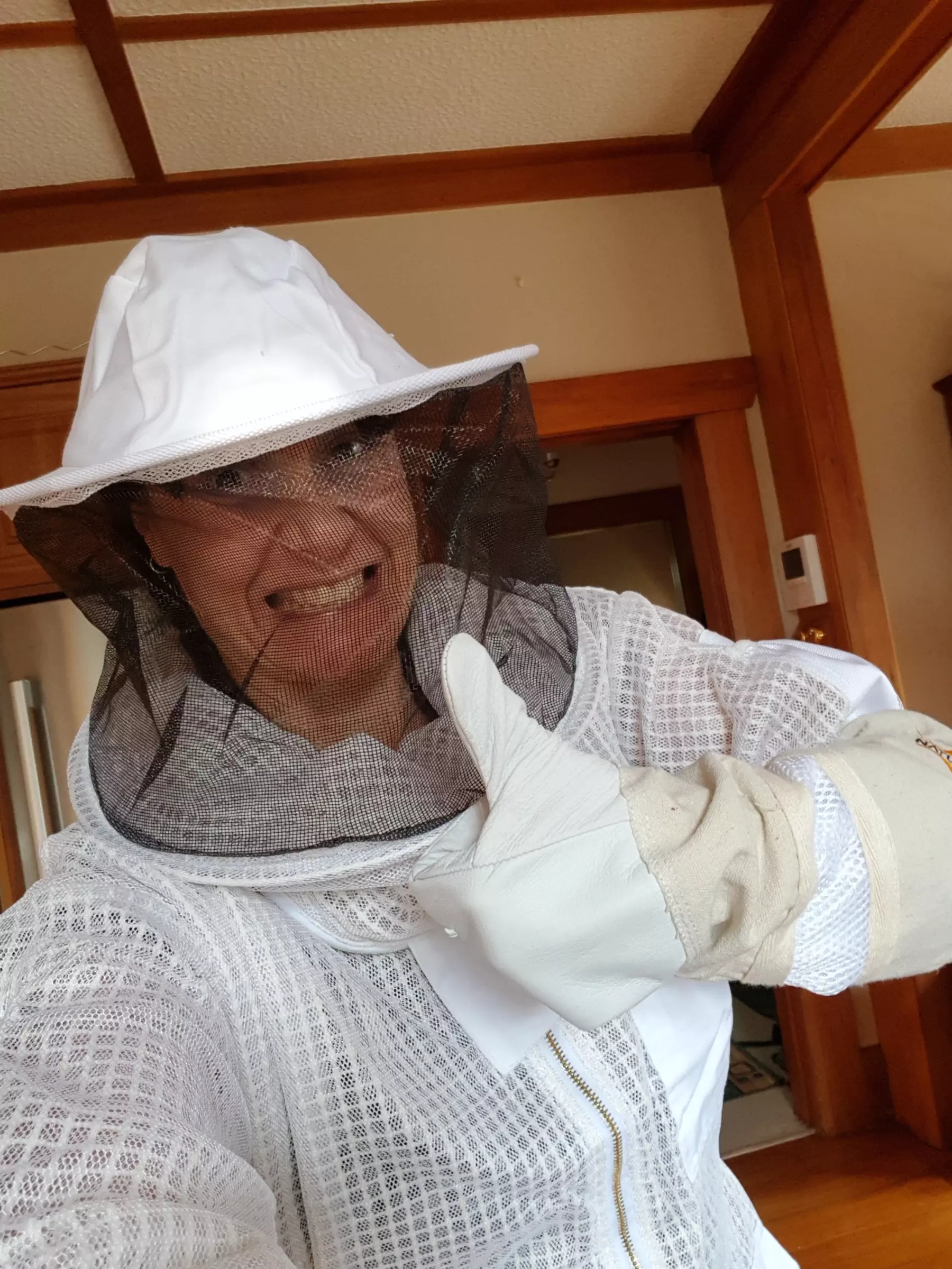 A particularly sexy photo of Josephine Fahy in a bee suit giving a thumbs up