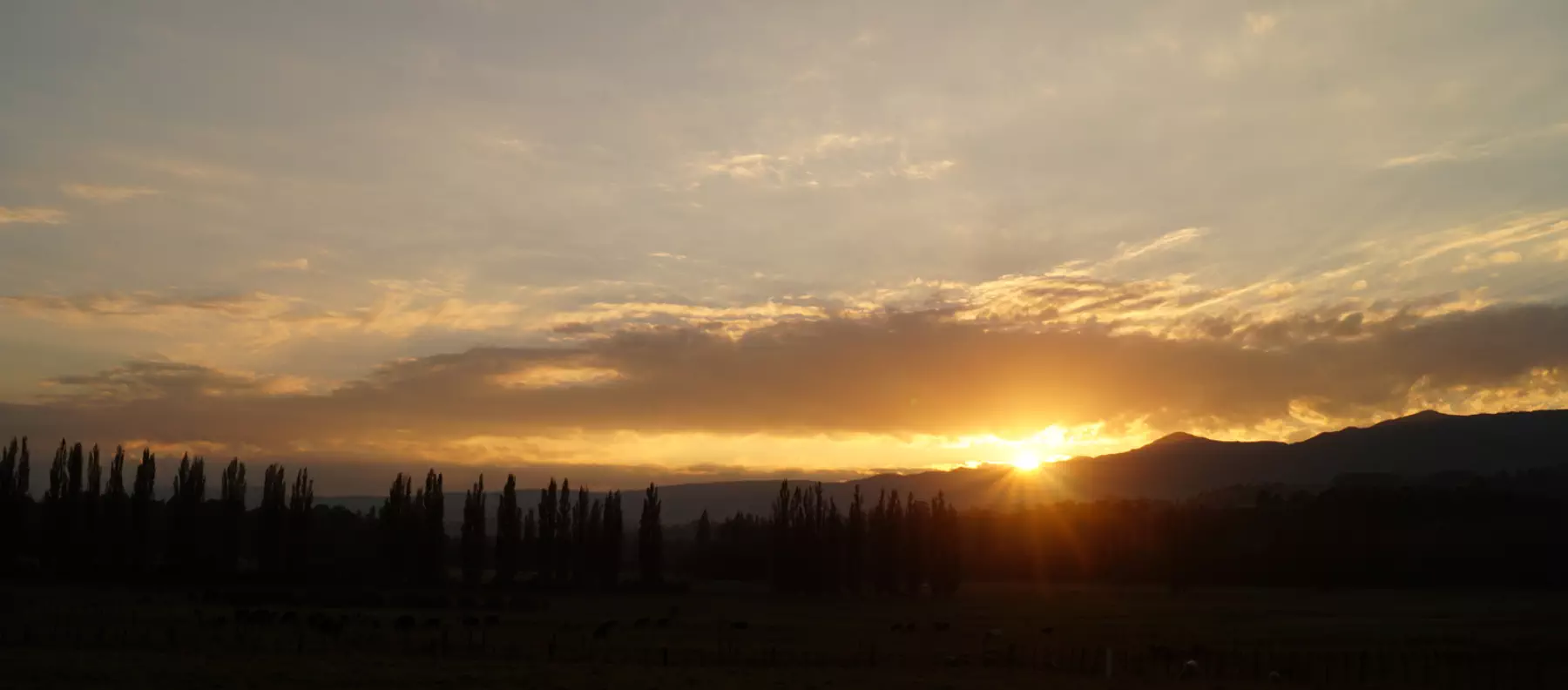 The sun rising in dramatic fashion over the Tararua Ranges